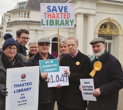 Uttlesford Lib Dem campaigners hand over their local petition signatures to County Councillor Stephen Robinson. of the official opposition group on Essex County Council.
